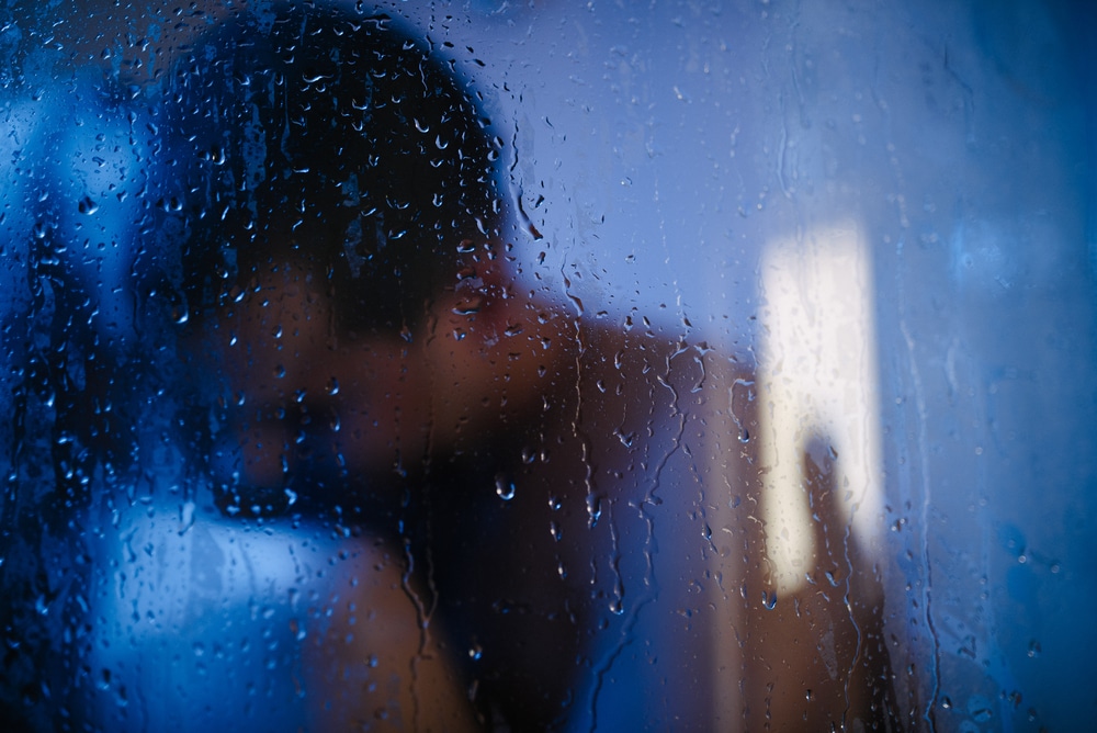 Silhouettes of a couple behind steamy glass, symbolising a sensual encounter in London